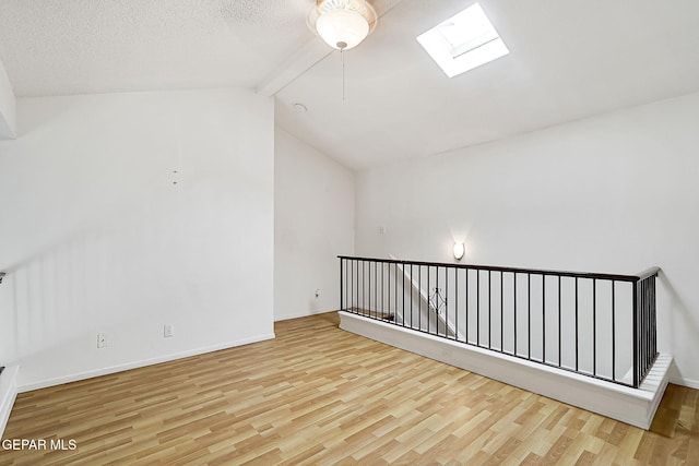 3400 Buffalo Soldier Cir, El Paso, TX 79936 - unfurnished room with a skylight, wood finished floors, and baseboards