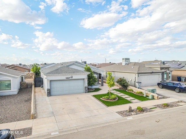 14837 Tierra Crystal Ave, El Paso, TX 79938 - view of front facade featuring a residential view, a gate, driveway, and an attached garage