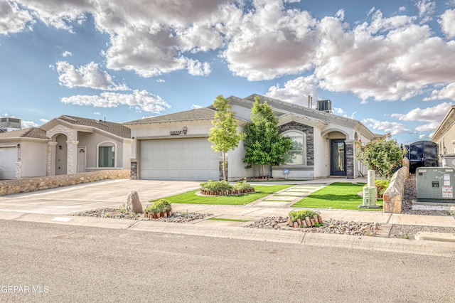 14837 Tierra Crystal Ave, El Paso, TX 79938 - view of front facade featuring stucco siding, a garage, and concrete driveway