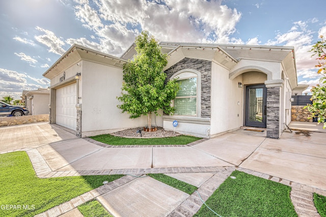 14837 Tierra Crystal Ave, El Paso, TX 79938 - view of front of house featuring a garage, concrete driveway, and stucco siding