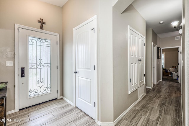14837 Tierra Crystal Ave, El Paso, TX 79938 - entryway featuring wood tiled floors, arched walkways, and baseboards