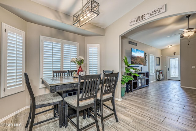 14837 Tierra Crystal Ave, El Paso, TX 79938 - dining room with vaulted ceiling, wood tiled floors, baseboards, ceiling fan, and arched walkways