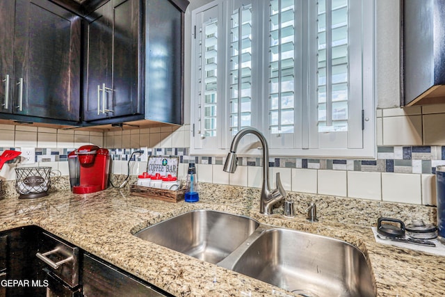 14837 Tierra Crystal Ave, El Paso, TX 79938 - kitchen with a sink, backsplash, and dark brown cabinetry
