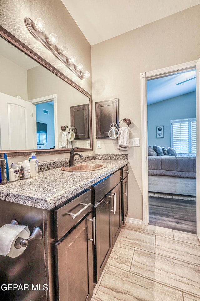 14837 Tierra Crystal Ave, El Paso, TX 79938 - ensuite bathroom featuring vanity and baseboards