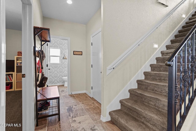 5525 Valley Cedar Dr, El Paso, TX 79932 - entrance foyer featuring stairway, baseboards, and stone finish floors