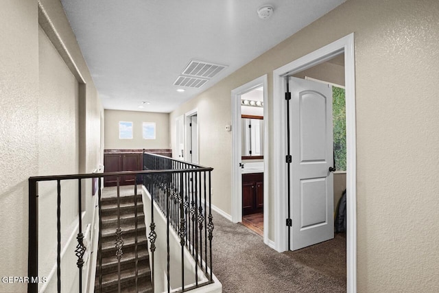 5525 Valley Cedar Dr, El Paso, TX 79932 - hallway featuring an upstairs landing, carpet, a textured wall, and baseboards