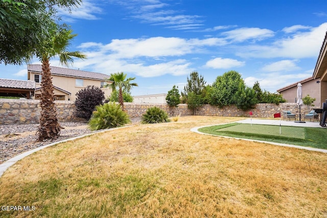 5525 Valley Cedar Dr, El Paso, TX 79932 - view of yard with a putting green