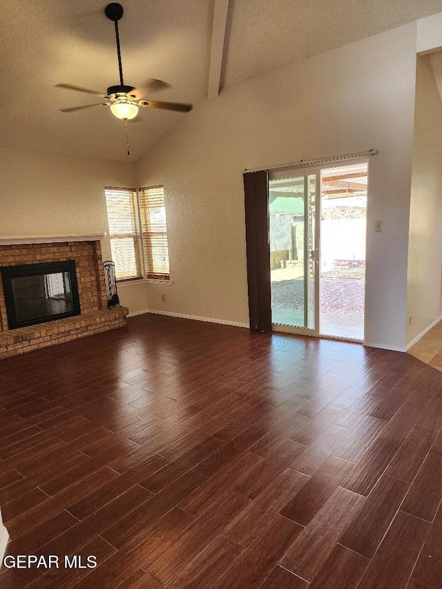 unfurnished living room featuring wood finished floors, ceiling fan, baseboards, and a fireplace