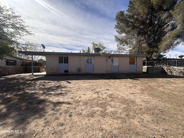 305 Corvena Way, El Paso, TX 79922 - back of house featuring brick siding and fence