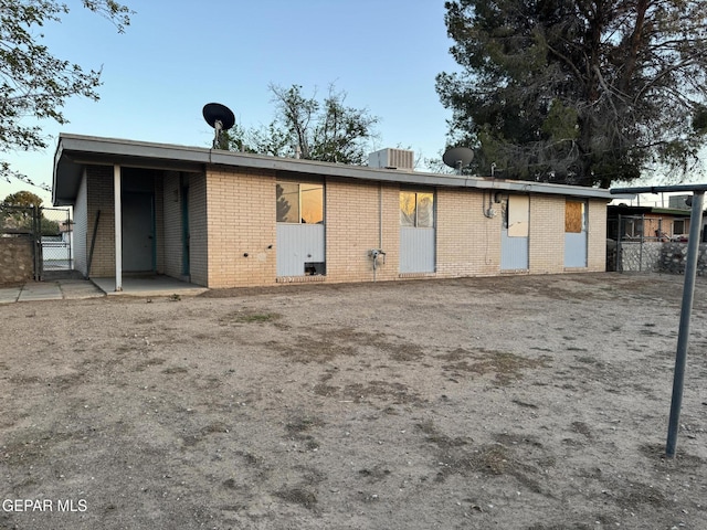 305 Corvena Way, El Paso, TX 79922 - rear view of property with a gate, brick siding, fence, and central air condition unit