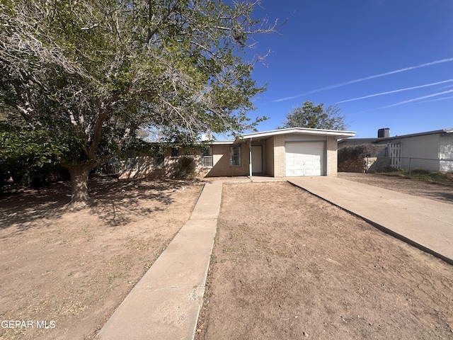 305 Corvena Way, El Paso, TX 79922 - view of front of house featuring a garage, driveway, and fence