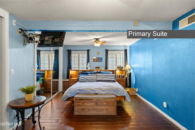 5051 Montoya Dr, El Paso, TX 79922 - bedroom with a textured ceiling, wood finish floors, and baseboards