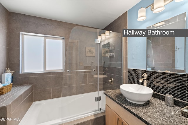 5051 Montoya Dr, El Paso, TX 79922 - bathroom with a tile shower, tasteful backsplash, and vanity