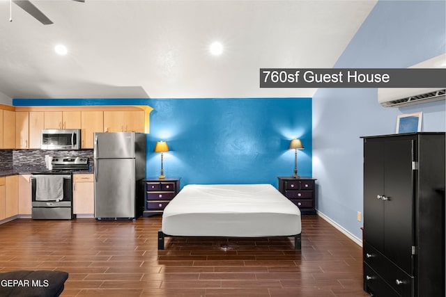 5051 Montoya Dr, El Paso, TX 79922 - bedroom featuring freestanding refrigerator, dark wood-style floors, baseboards, and recessed lighting
