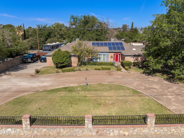 5051 Montoya Dr, El Paso, TX 79922 - view of front of property featuring curved driveway and roof mounted solar panels