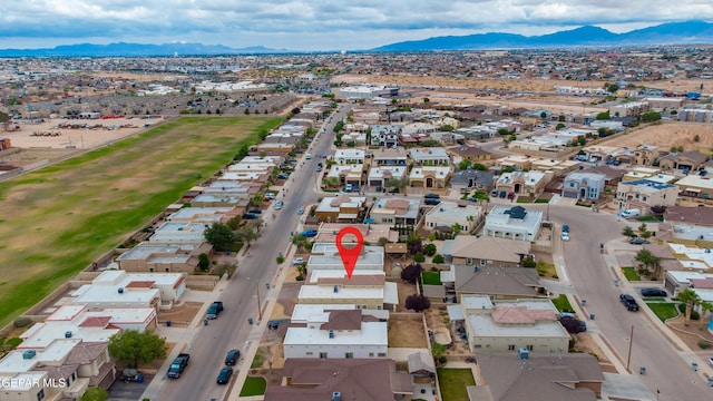 14117 Rainbow Point Dr, El Paso, TX 79938 - aerial view of property's location featuring a mountain backdrop and nearby suburban area