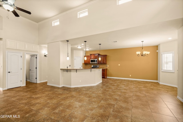 14117 Rainbow Point Dr, El Paso, TX 79938 - unfurnished living room with a chandelier, a ceiling fan, crown molding, and a high ceiling