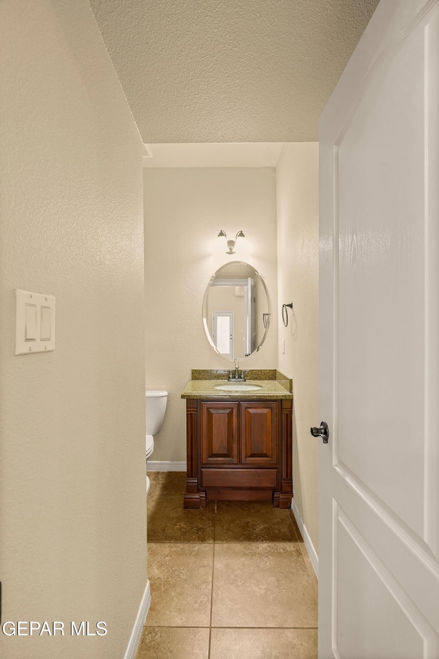14117 Rainbow Point Dr, El Paso, TX 79938 - bathroom featuring vanity, a textured ceiling, and tile patterned flooring