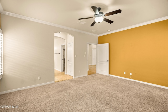 14117 Rainbow Point Dr, El Paso, TX 79938 - unfurnished bedroom featuring arched walkways, ornamental molding, light colored carpet, and ceiling fan