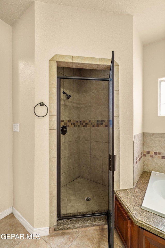 14117 Rainbow Point Dr, El Paso, TX 79938 - bathroom with a stall shower and tile patterned floors