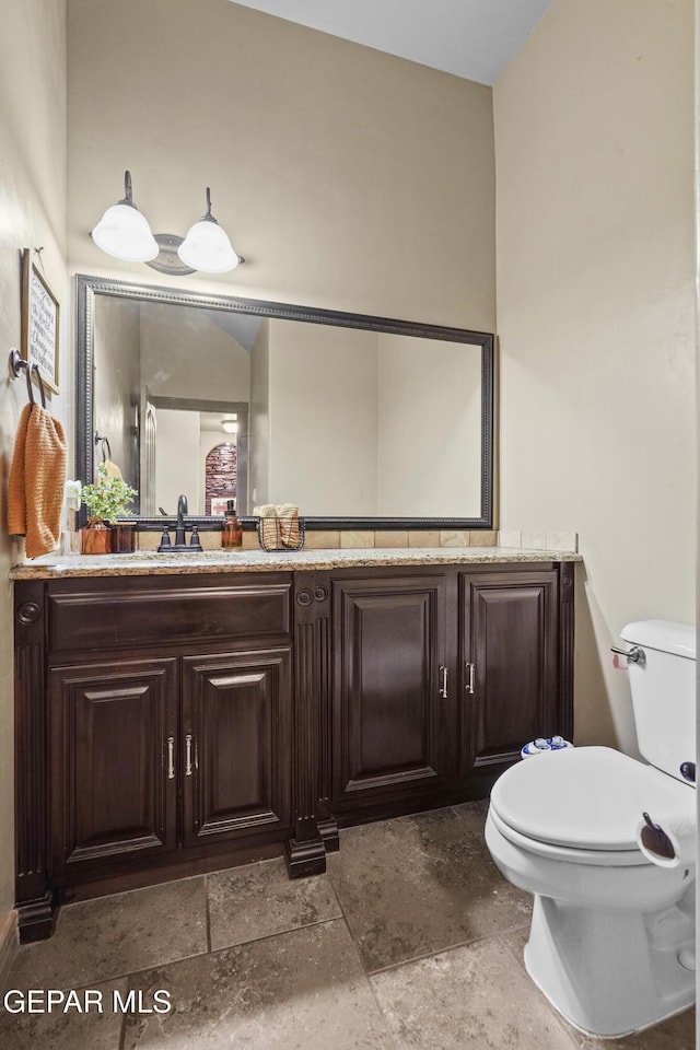 3089 Snowy Point Dr, El Paso, TX 79938 - bathroom with stone tile flooring, toilet, and vanity