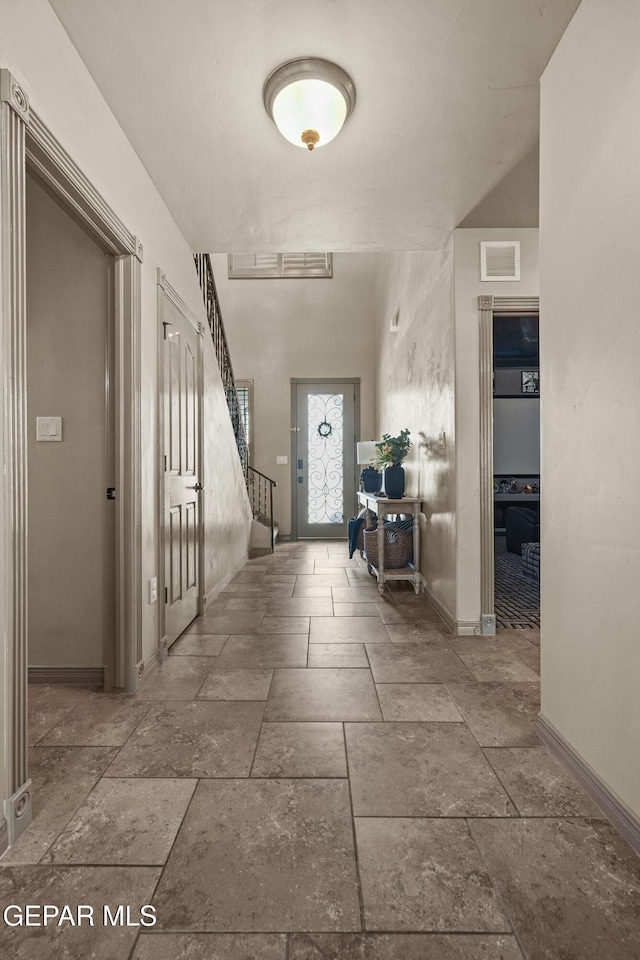 3089 Snowy Point Dr, El Paso, TX 79938 - corridor featuring stone tile flooring and baseboards