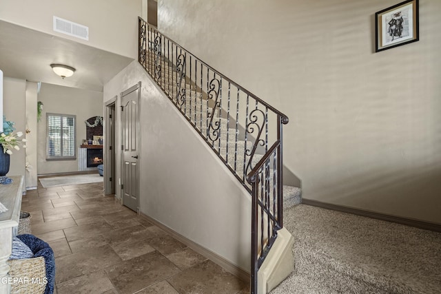 3089 Snowy Point Dr, El Paso, TX 79938 - stairs with baseboards, stone tile flooring, and a high ceiling