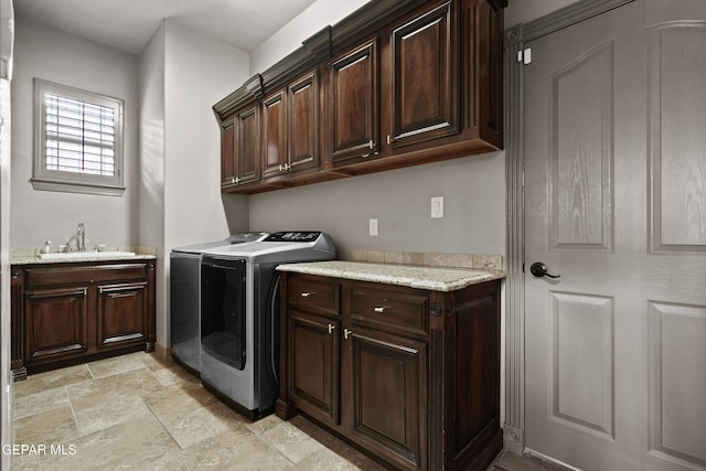 3089 Snowy Point Dr, El Paso, TX 79938 - laundry area with cabinet space, washer and dryer, and stone tile floors