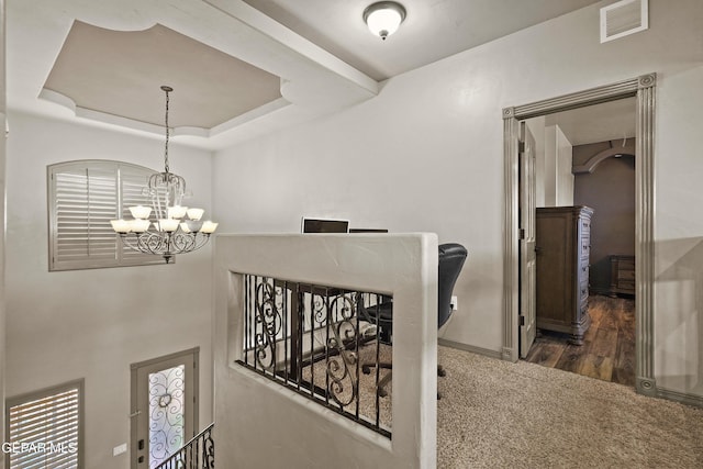 3089 Snowy Point Dr, El Paso, TX 79938 - hallway featuring a chandelier, carpet flooring, baseboards, and a raised ceiling