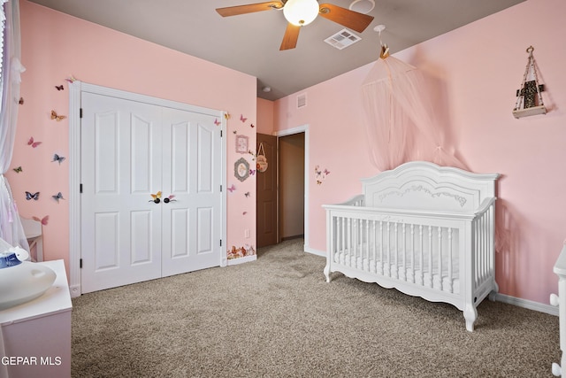 3089 Snowy Point Dr, El Paso, TX 79938 - carpeted bedroom featuring a crib, a closet, a ceiling fan, and baseboards
