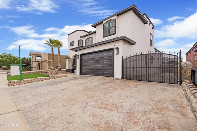 3089 Snowy Point Dr, El Paso, TX 79938 - view of front of property featuring a garage, a gate, stucco siding, concrete driveway, and fence