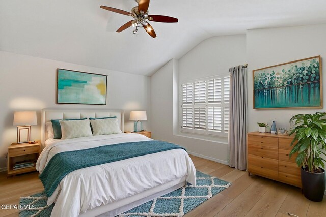 6140 Los Robles Dr, El Paso, TX 79912 - bedroom with vaulted ceiling, wood finished floors, and ceiling fan