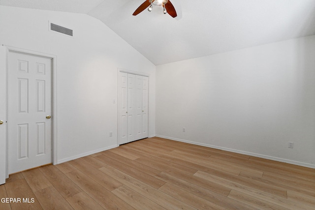 6140 Los Robles Dr, El Paso, TX 79912 - unfurnished bedroom featuring vaulted ceiling, light wood-style floors, a ceiling fan, and a closet