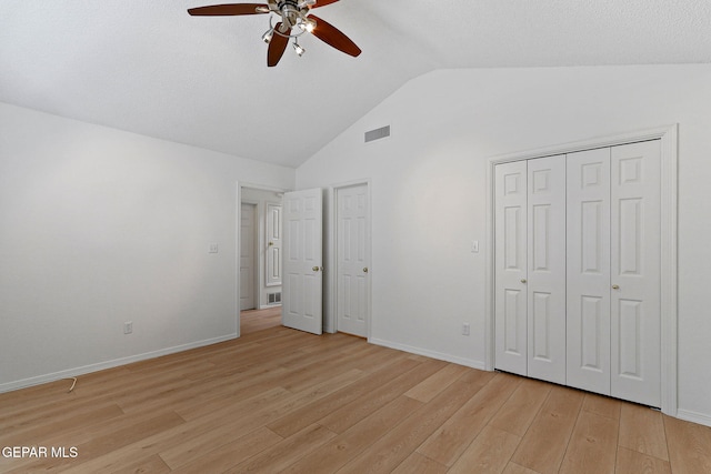 6140 Los Robles Dr, El Paso, TX 79912 - unfurnished bedroom with light wood finished floors, a ceiling fan, a closet, and high vaulted ceiling