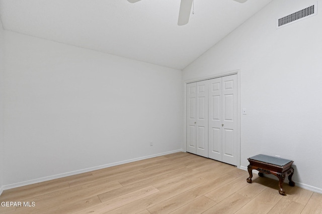 6140 Los Robles Dr, El Paso, TX 79912 - unfurnished bedroom featuring light wood-style floors, vaulted ceiling, a closet, and ceiling fan