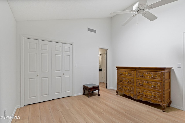 6140 Los Robles Dr, El Paso, TX 79912 - bedroom featuring light wood-style floors, a closet, ceiling fan, and high vaulted ceiling