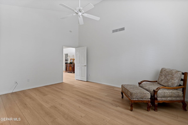 6140 Los Robles Dr, El Paso, TX 79912 - living area with light wood finished floors, a high ceiling, and ceiling fan