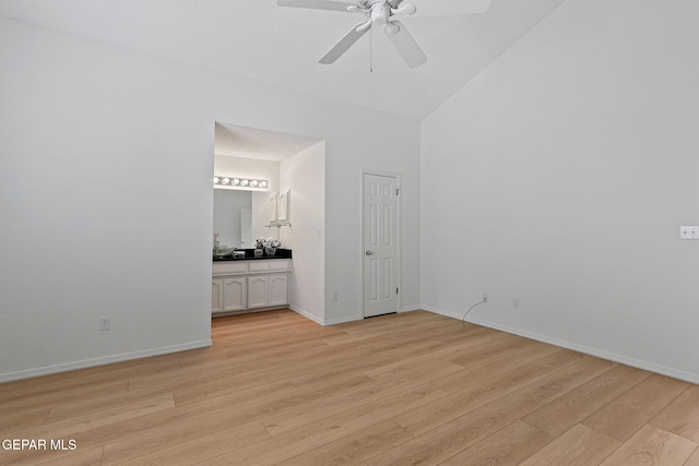 6140 Los Robles Dr, El Paso, TX 79912 - unfurnished bedroom featuring light wood finished floors, high vaulted ceiling, ensuite bath, and ceiling fan