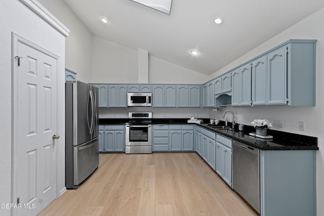 6140 Los Robles Dr, El Paso, TX 79912 - kitchen featuring stainless steel appliances, vaulted ceiling, light wood-style flooring, and recessed lighting