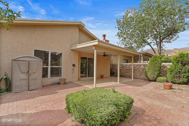 6140 Los Robles Dr, El Paso, TX 79912 - back of property with stucco siding, a ceiling fan, and a patio area