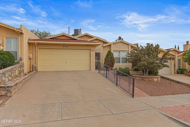 6140 Los Robles Dr, El Paso, TX 79912 - ranch-style house featuring stucco siding, concrete driveway, and a garage