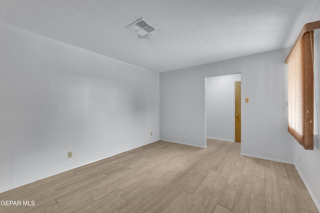 10125 Castletown Dr, El Paso, TX 79925 - unfurnished room featuring a textured ceiling and light wood finished floors