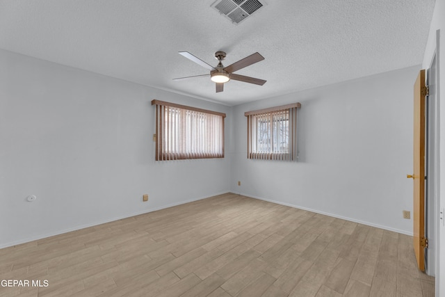 10125 Castletown Dr, El Paso, TX 79925 - empty room with ceiling fan, light wood-type flooring, a textured ceiling, and baseboards