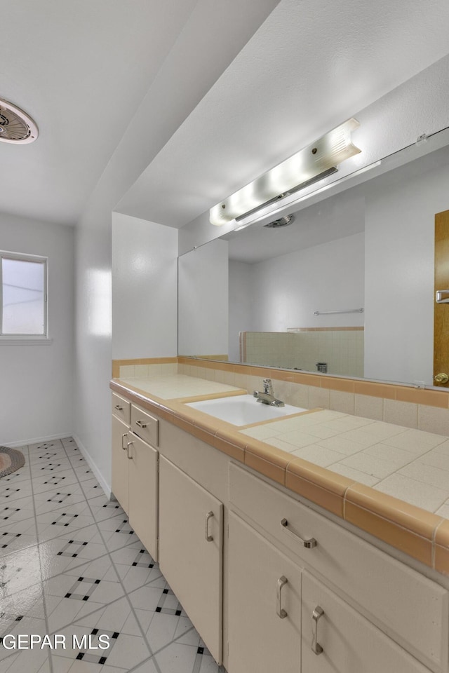 10125 Castletown Dr, El Paso, TX 79925 - bathroom with tile patterned flooring, vanity, and baseboards