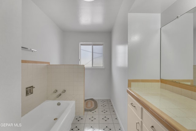 10125 Castletown Dr, El Paso, TX 79925 - full bath with a bath, baseboards, vanity, and decorative backsplash