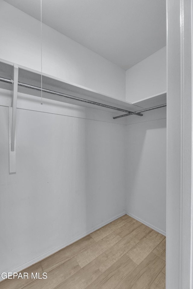 10125 Castletown Dr, El Paso, TX 79925 - spacious closet featuring light wood-type flooring