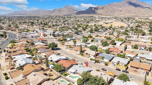 view of property location with mountains and nearby suburban area
