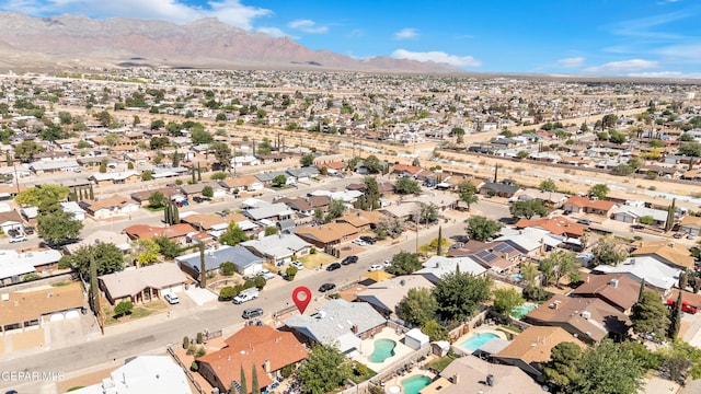 aerial perspective of suburban area featuring a mountainous background