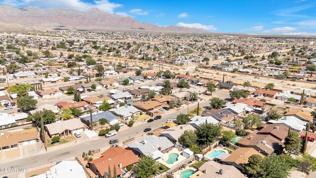 aerial view of residential area featuring a mountain backdrop