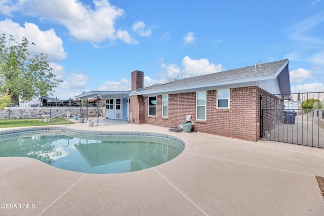 view of pool featuring a patio area and fence